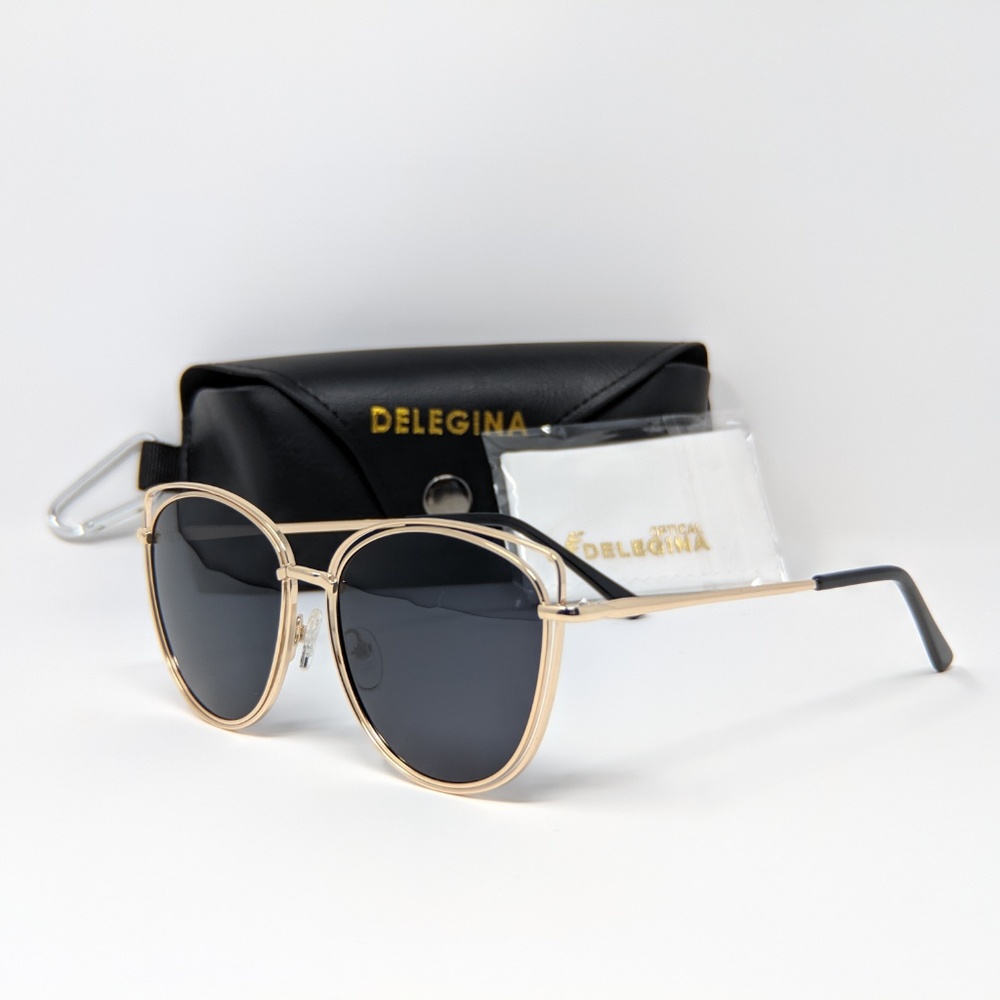 Stylish black sunglasses with bold gold trim - Picture 3 of 4